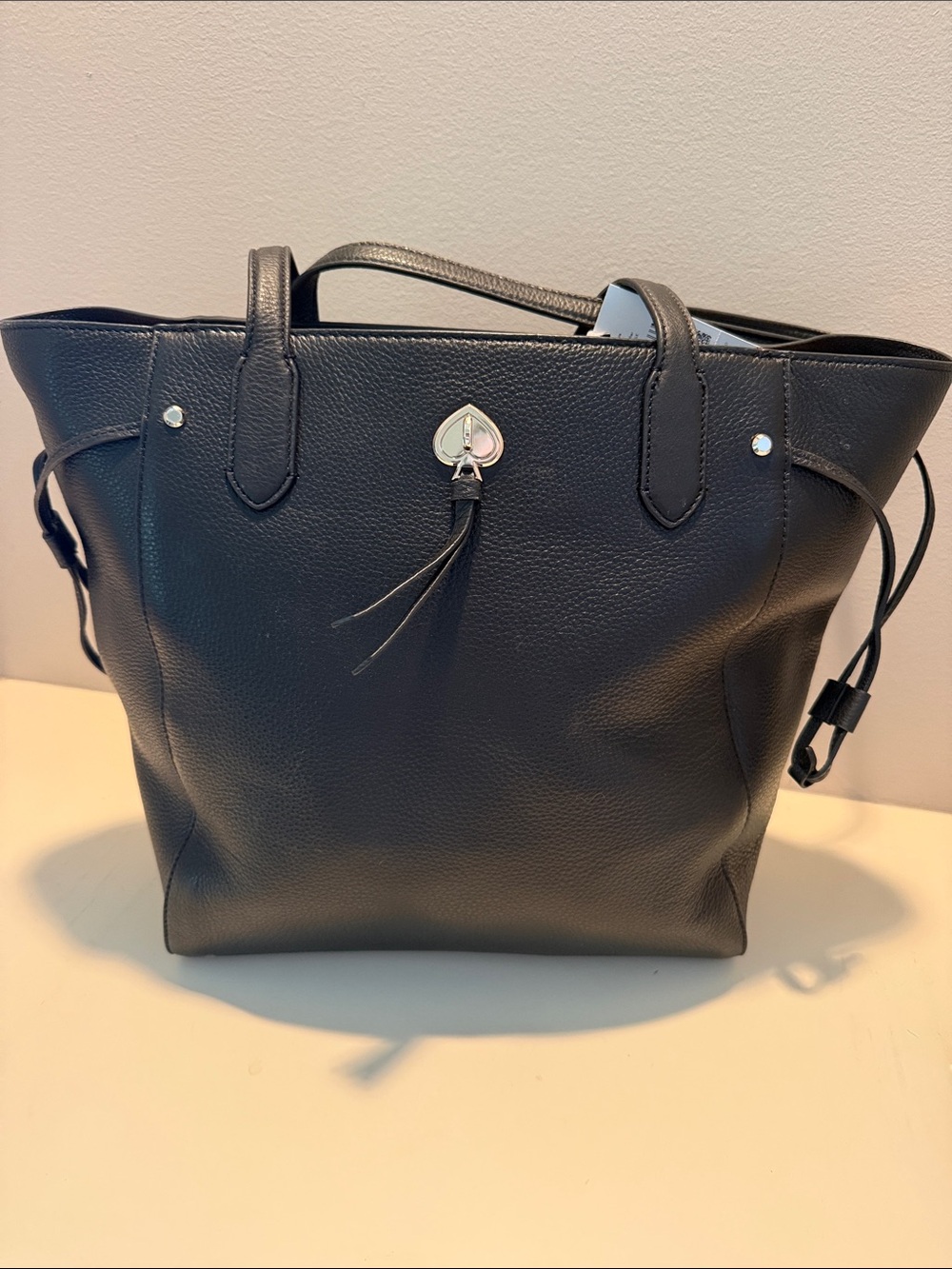 kate spade Black Pebbled Leather Tote with Heart Tassel
